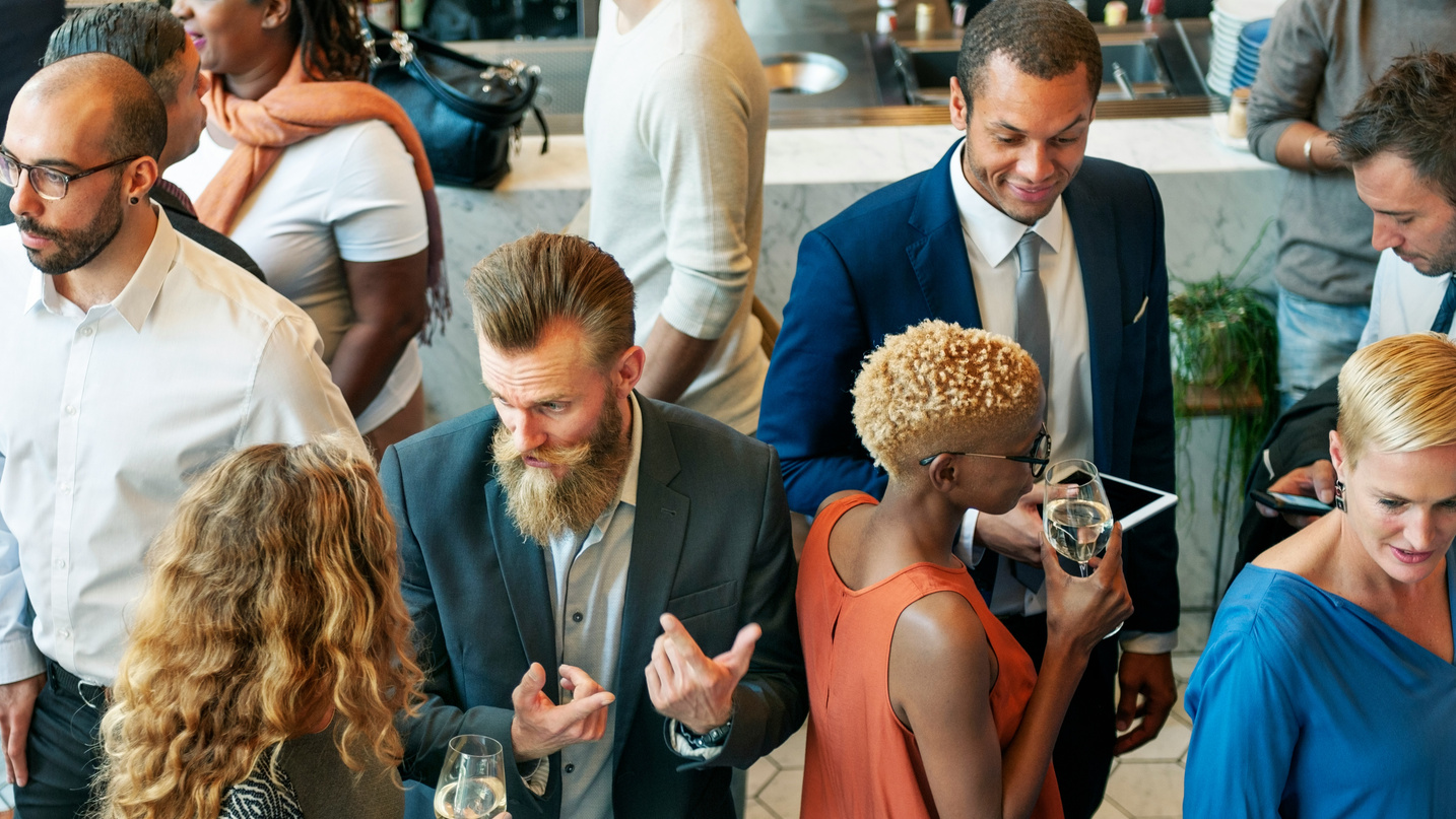 People talking at a local business event